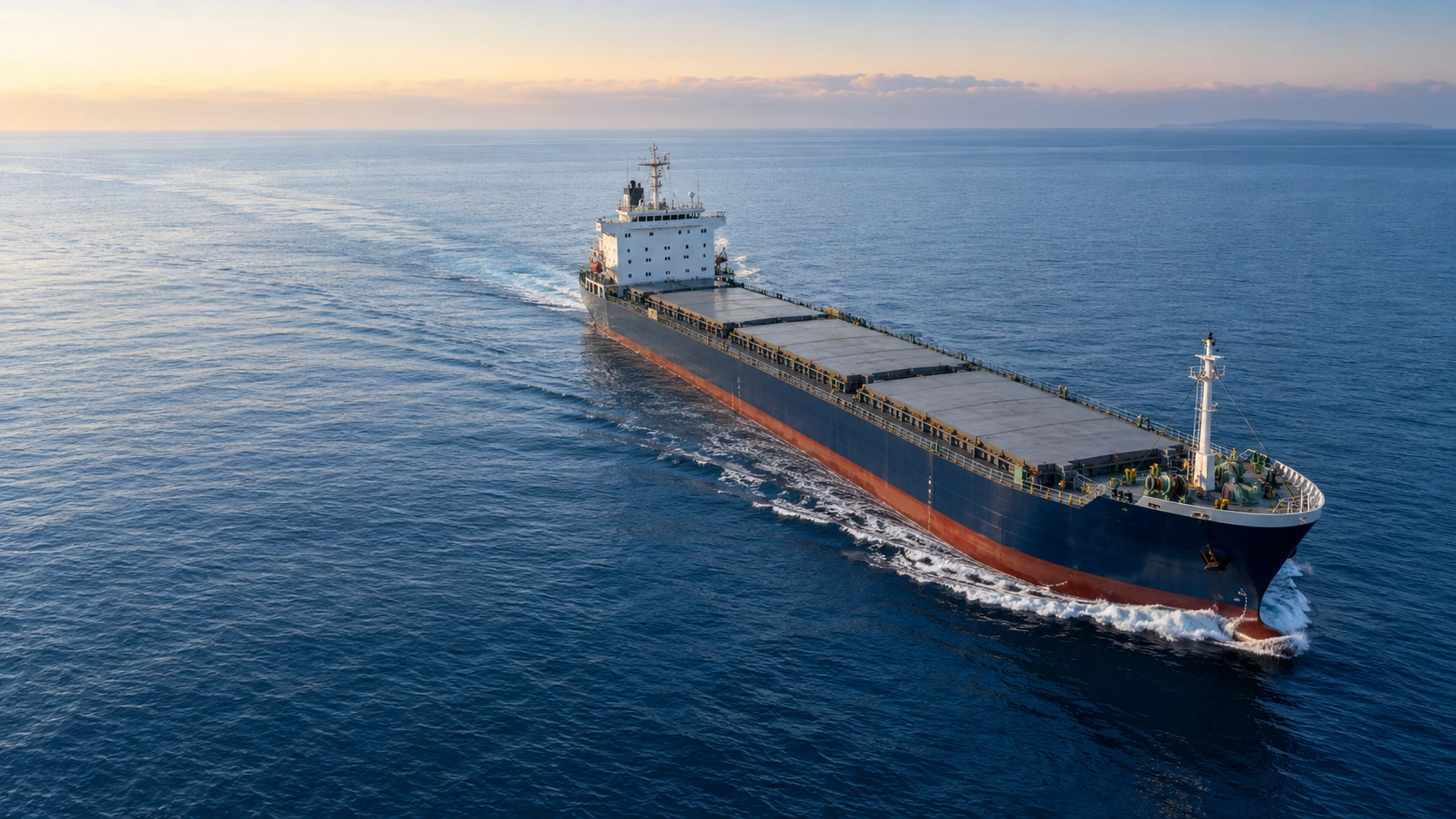 Illustration of a dry cargo vessel crossing the open sea